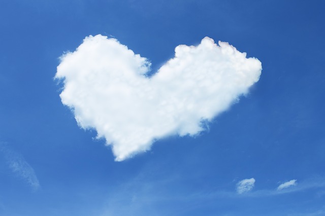 A white heart cloud in a deep blue sky
